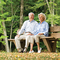 A couple sitting on a bench. Links to Tangible Personal Property